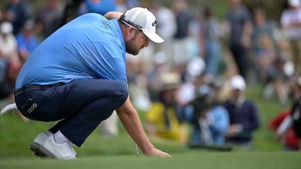 Marc Leishman of Australia lines up a putt on Sunday.