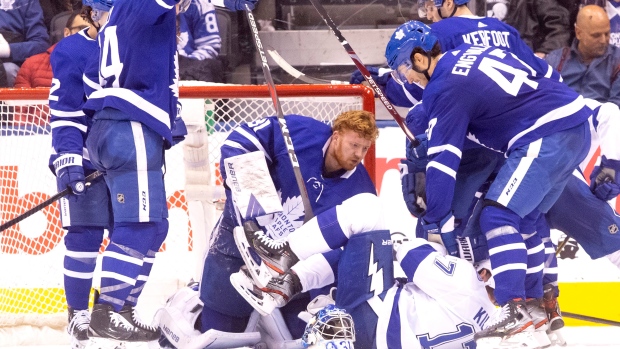 Leafs goalie Frederik Andersen mixes it up with Tampa Bay's Alex Killorn on Tuesday night.