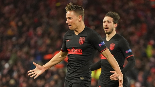 Marcos Llorente, left, celebrates