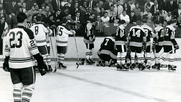 Boston Bruins stand over a fallen Bobby Orr, Frank O'Brien/Boston Globe Boston Bruins stand over a fallen Bobby Orr