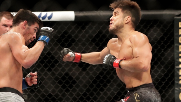 Henry Cejudo punches Dominick Cruz , The Canadian Press Henry Cejudo punches Dominick Cruz