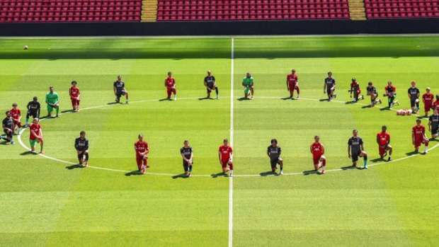 Liverpool players take a knee