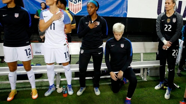 Megan Rapinoe kneels during national anthem, The Canadian Press Megan Rapinoe kneels during national anthem