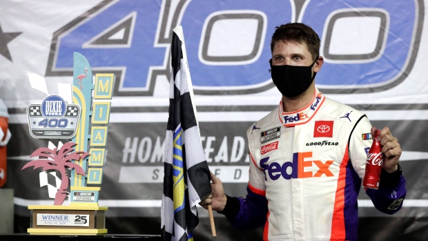 Denny Hamlin celebrates, The Canadian Press Denny Hamlin celebrates