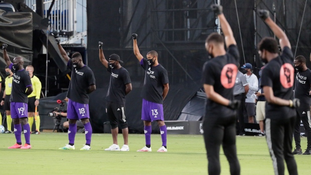 Orlando City players raise fists