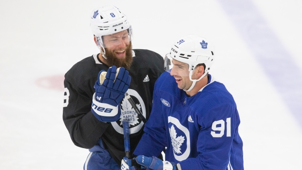 Toronto Maple Leafs' John Tavares (right) shares a joke with teammate Jake Muzzin , The Canadian Press Toronto Maple Leafs' John Tavares (right) shares a joke with teammate Jake Muzzin