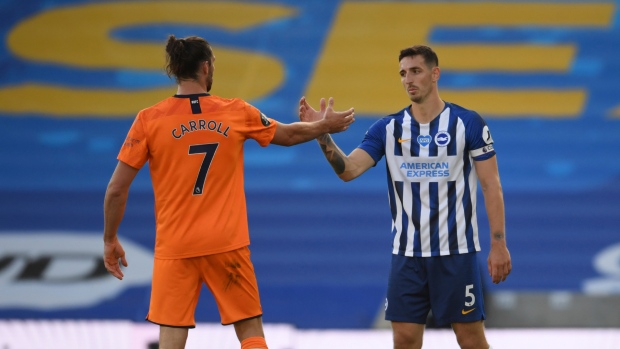 Newcastle's Andy Carroll and Brighton's Lewis Dunk, The Canadain Press Newcastle's Andy Carroll and Brighton's Lewis Dunk