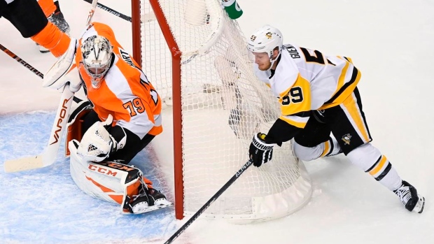 Carter Hart and Jake Guentzel, The Canadian Press Carter Hart and Jake Guentzel