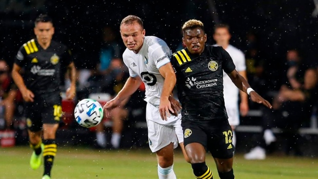 Minnesota United defender Chase Gasper and Columbus Crew midfielder Luis Diaz