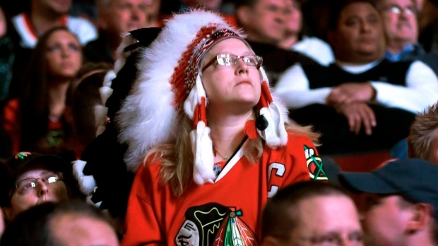 Fan wears Native American headdress at Blackhawks game