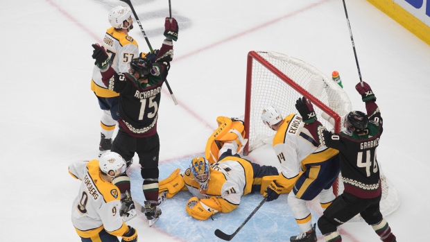 Coyotes' Brad Richardson and teammate Michael Grabner celebrate a goal during over overtim