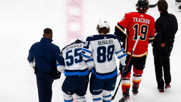 Mark Scheifele helped off the ice, Getty Images Mark Scheifele helped off the ice