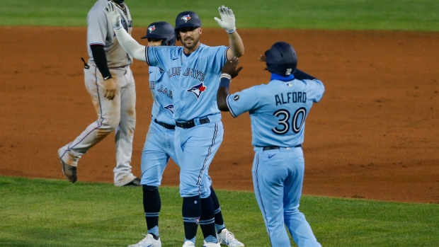 Travis Shaw, Blue Jays celebrate, The Canadian Press Travis Shaw, Blue Jays celebrate