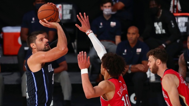 Nikola Vucevic and Jaxson Hayes , The Canadian Press Nikola Vucevic and Jaxson Hayes