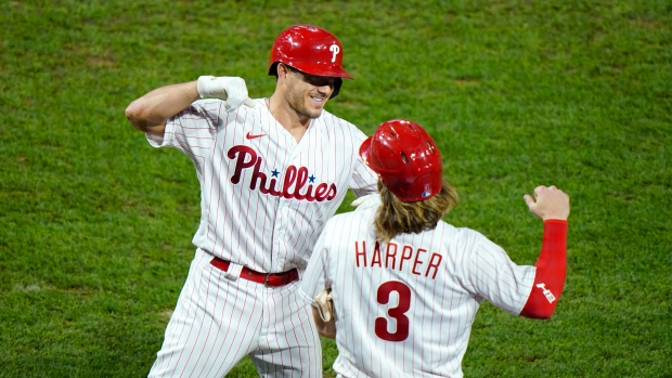 J.T. Realmuto and Bryce Harper, The Canadian Press J.T. Realmuto and Bryce Harper