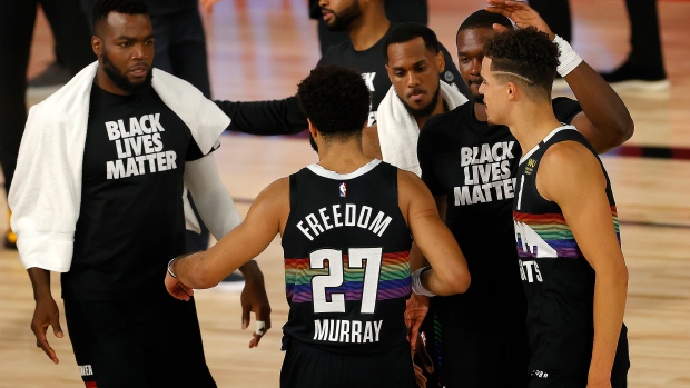 Jamal Murray celebrates with teammates , The Canadian Press Jamal Murray celebrates with teammates