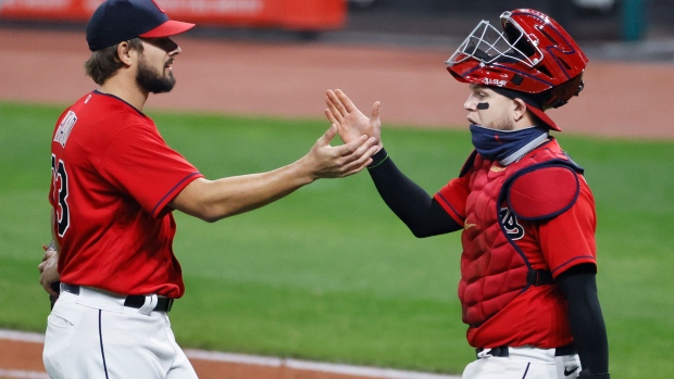 Brad Hand and Roberto Perez celebrate , The Canadian Press Brad Hand and Roberto Perez celebrate