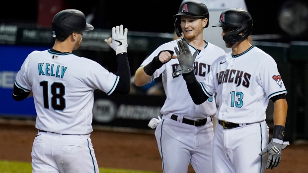 Carson Kelly (18) celebrates hit three-run home run against the Texas Rangers 