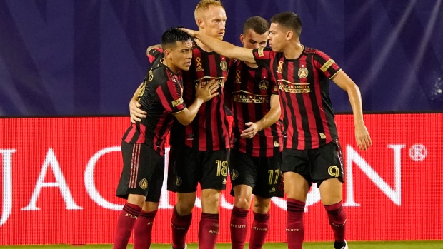 Jeff Larentowicz, Atlanta FC players celebrate, The Canadian Press Jeff Larentowicz, Atlanta FC players celebrate