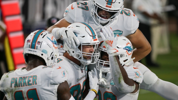 Mike Gesicki and Dolphins Celebrate, The Canadian Press Mike Gesicki and Dolphins Celebrate