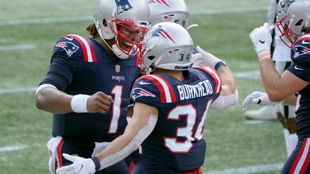 Cam Newton, Rex Burkhead, The Canadian Press Cam Newton, Rex Burkhead
