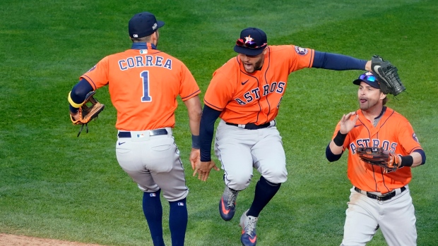 Houston Astros' Carlos Correa, left, and George Springer, celebrate