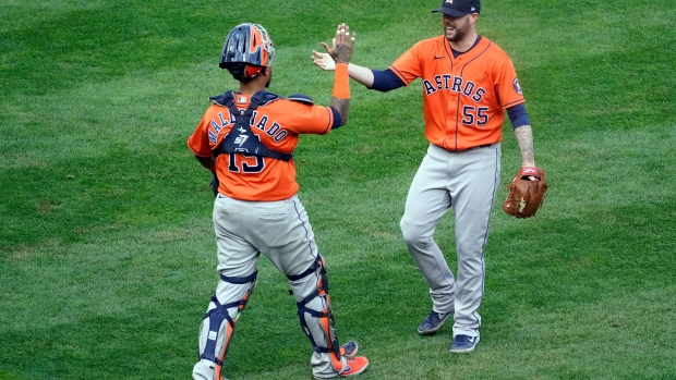 Ryan Pressly and Martin Maldonado celebrate