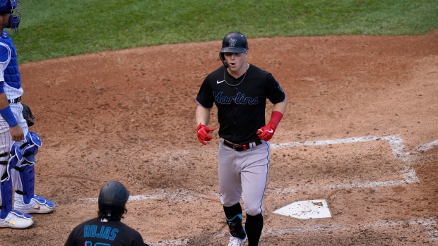 Cubs catcher Willson Contreras stands by as Marlins' Miguel Rojas celebrates with Corey Dickerson, The Canadian Press Cubs catcher Willson Contreras stands by as Marlins' Miguel Rojas celebrates with Corey Dickerson