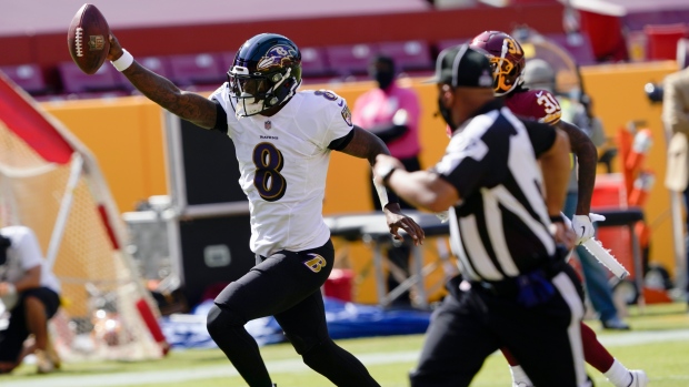 Baltimore Ravens' Lamar Jackson scores against Washington Football