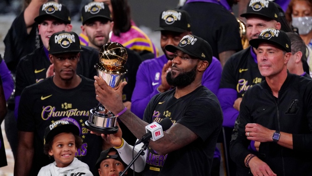 LeBron James (23) holds NBA Finals MVP trophy, The Canadian Press LeBron James (23) holds NBA Finals MVP trophy