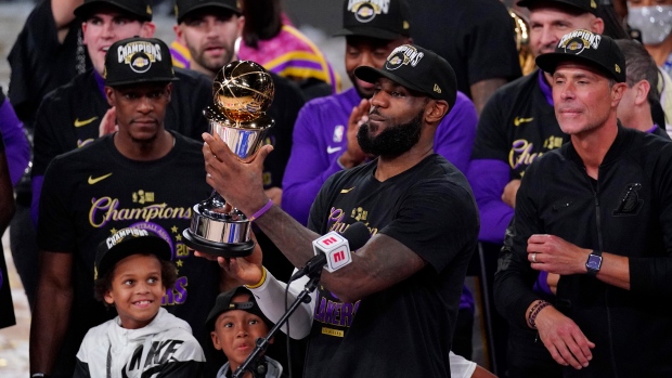 LeBron James holds NBA Finals MVP trophy