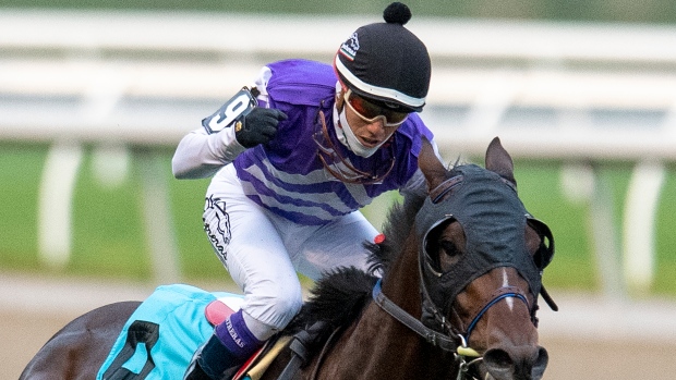 Jockey Luis Contreras celebrates aboard Belichick 