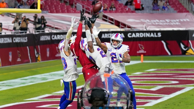 Cardinals' DeAndre Hopkins pulls in the game-winning catch over three Bills defenders
