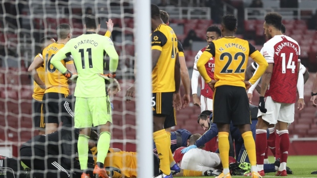 Arsenal, Wolves players stand over David Luiz and Raul Jimenez, The Canadian Press Arsenal, Wolves players stand over David Luiz and Raul Jimenez