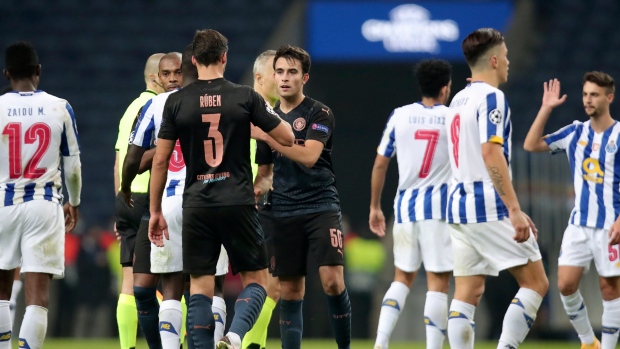 Manchester City's Eric Garcia, center, greets teammate Ruben Dias , The Canadian Press Manchester City's Eric Garcia, center, greets teammate Ruben Dias