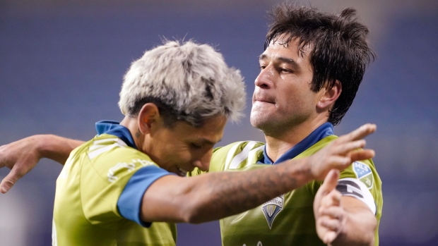 Seattle Sounders' Raul Ruidiaz and Nicolas Lodeiro celebrate