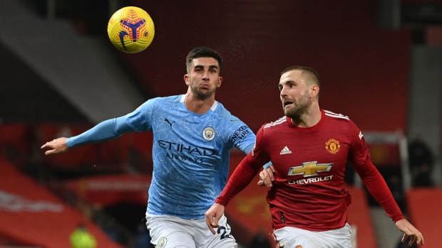 Manchester City's Joao Cancelo heads the ball during the Champions