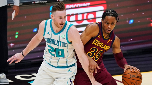 Cleveland Cavaliers' Isaac Okoro and Charlotte Hornets' Gordon Hayward