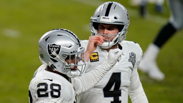 Las Vegas Raiders running back Josh Jacobs and Derek Carr