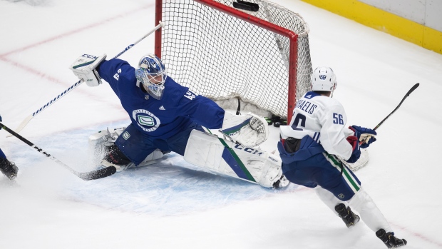 Marc Michaelis scores on Braden Holtby in Vancouver Canucks practice