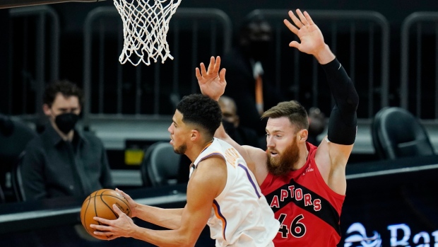 Phoenix Suns' Devin Booker and Toronto Raptors center Aron Baynes