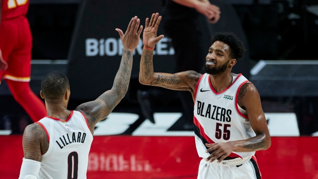 Derrick Jones Jr. and Damian Lillard