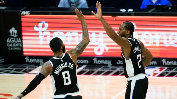 Marcus Morris Sr. and Kawhi Leonard celebrate