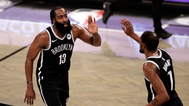 James Harden and Kevin Durant celebrate, The Canadian Press James Harden and Kevin Durant celebrate
