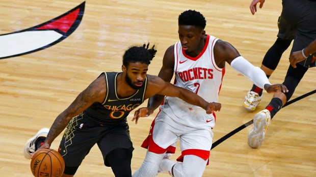 Coby White drives against Victor Oladipo