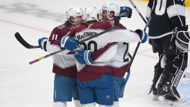 Matt Calvert, Nathan MacKinnon and Brandon Saad celebrate