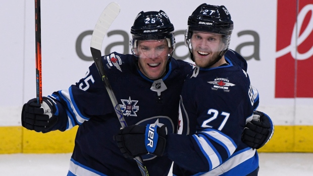 Connor scores twice, adds assist as Jets win home opener 6-4 over