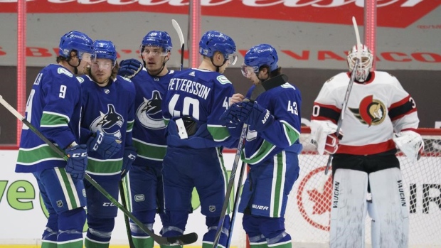 Brock Boeser and Canucks Celebrate, The Canadian Press Brock Boeser and Canucks Celebrate