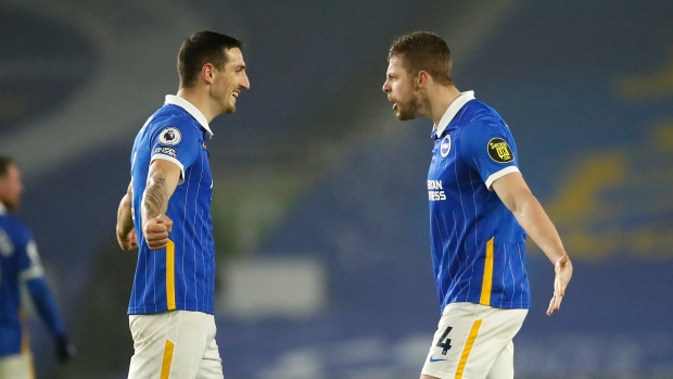 Brighton's Lewis Dunk and Adam Webster , The Canadian Press Brighton's Lewis Dunk and Adam Webster
