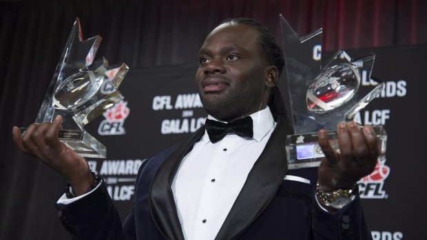 Solomon Elimimian with Most Outstanding Player, Most Outstanding Defensive Player trophies, The Canadian Press Solomon Elimimian with Most Outstanding Player, Most Outstanding Defensive Player trophies
